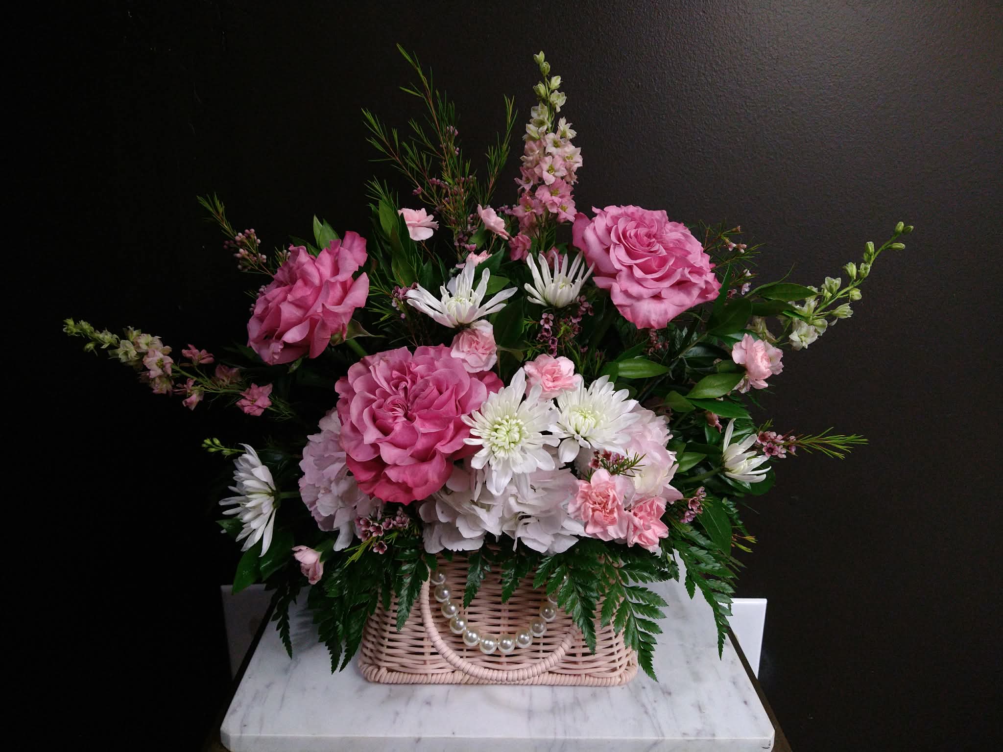 Wild Pearls Basket - Fresh pinks in a keepsake rectangle basket with purse handles and a pearl chain.