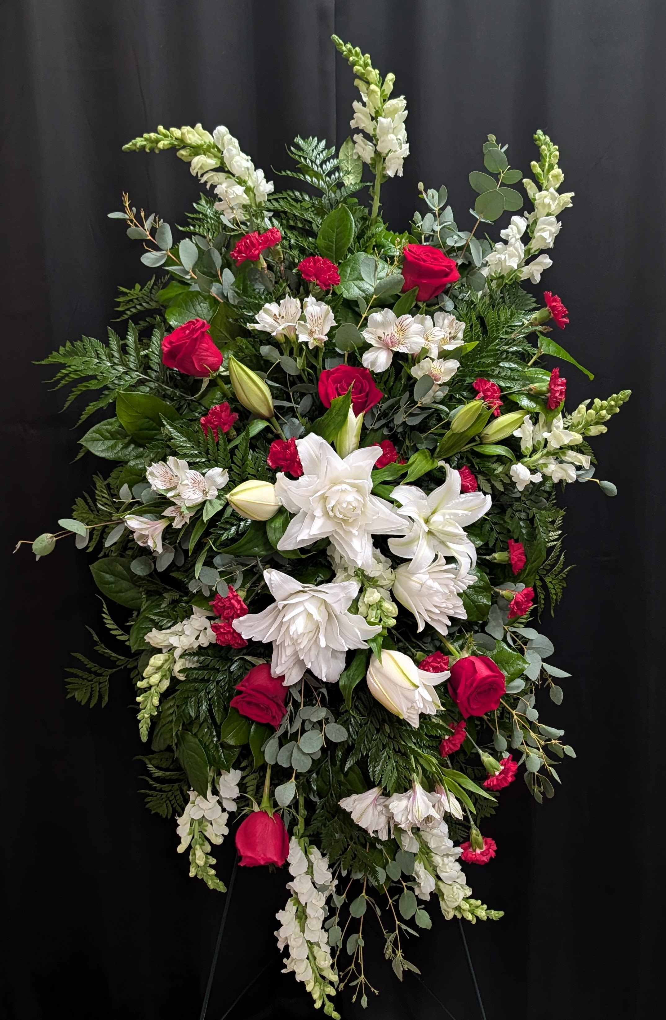 Everlasting Memory Standing Spray - Our Everlasting Memory Standing Spray combines timeless hues with unique blooms to honor the life of the one you have lost. Each lily, rose and snapdragon are elegantly curated to share your messages of peace, sympathy and love.