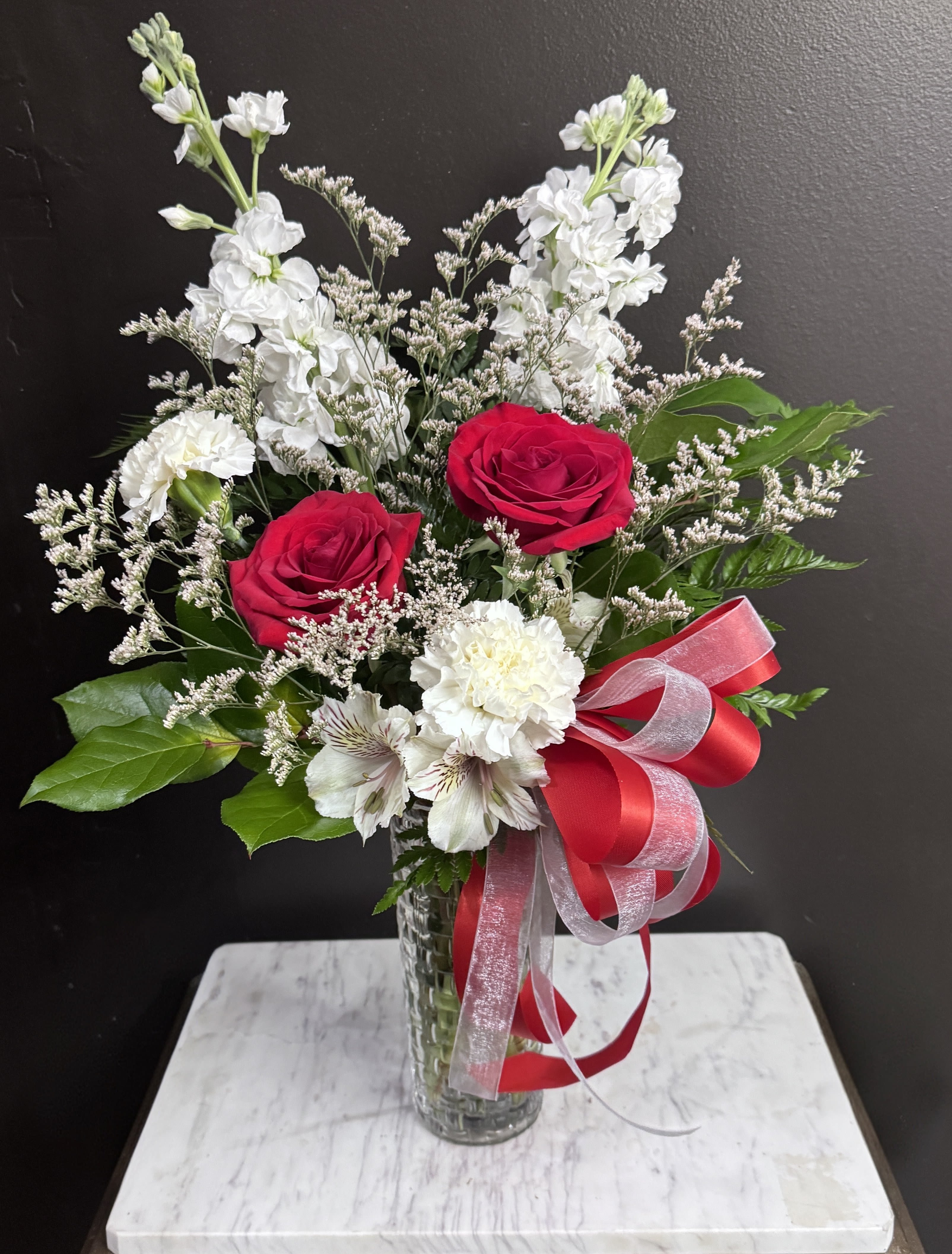 Touch of Love - Show a little love with red and white blooms in a basket textured vase.