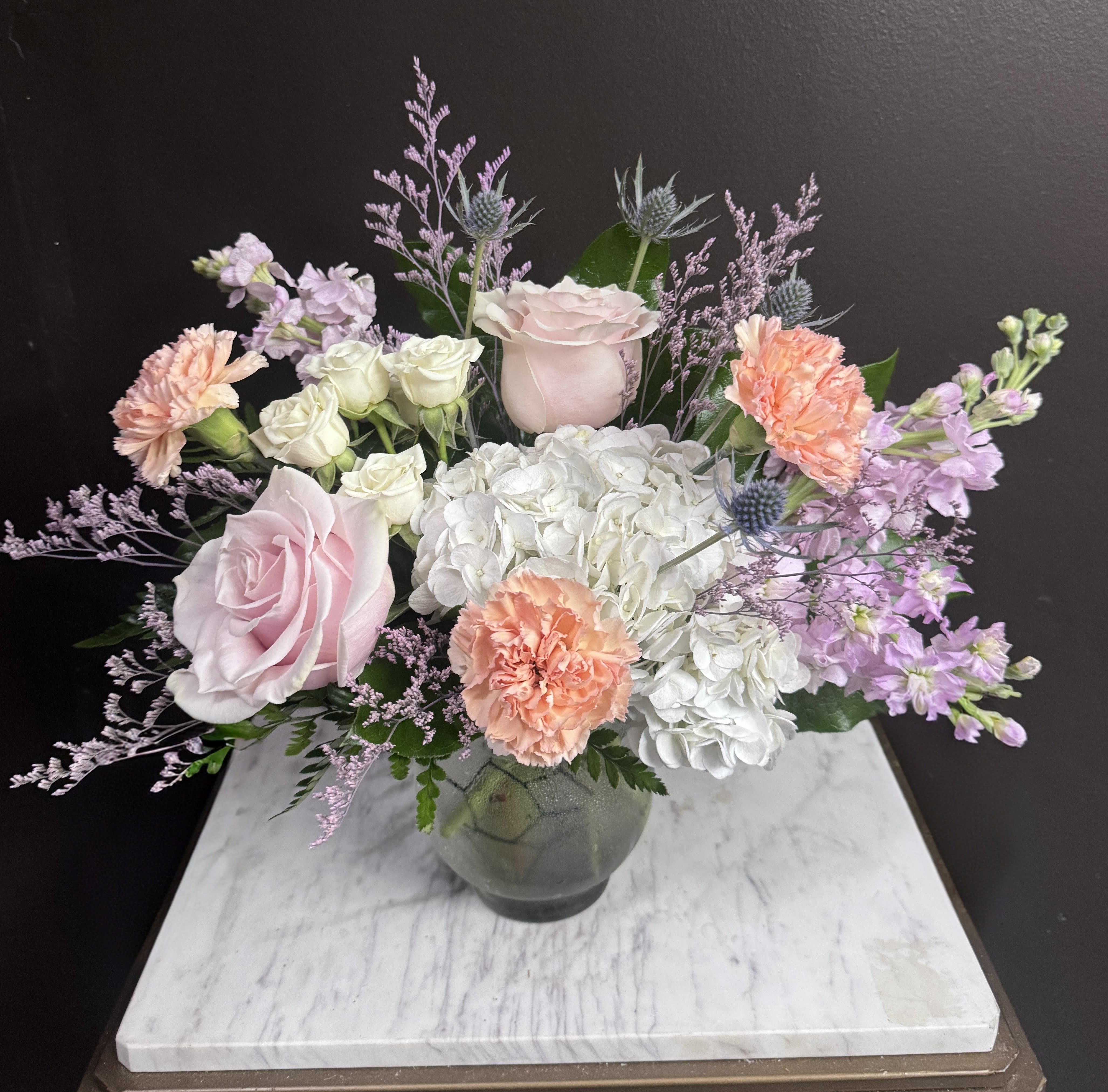 Porch Swing - Pastels arranged whimsically in a bubbly vase.