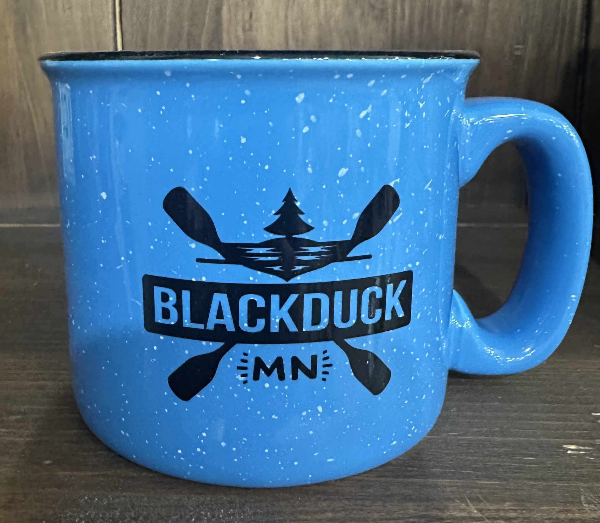 Blue speckled mug with a Blackduck MN logo
