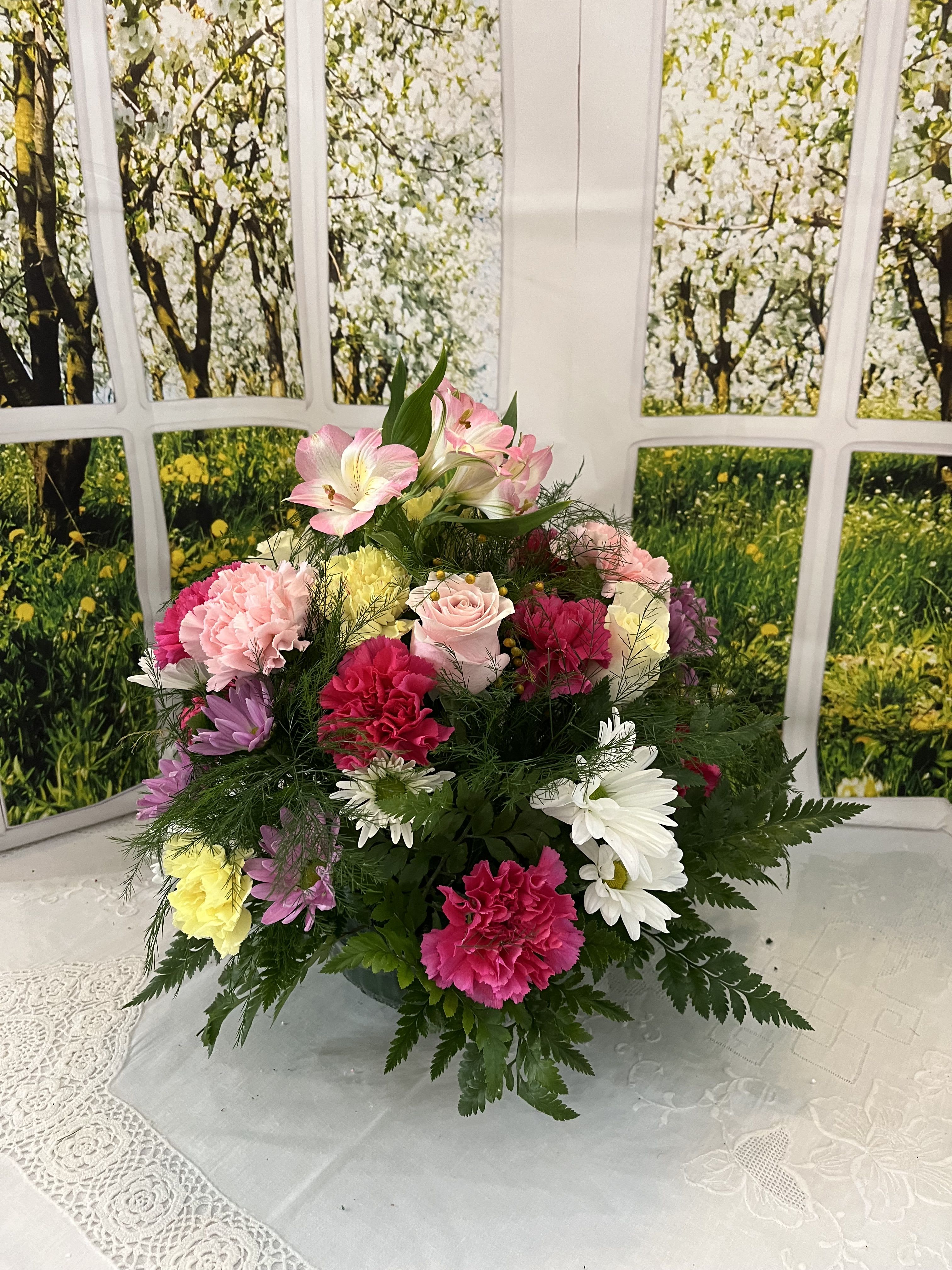 Mixed bouquet with pink, white, yellow, and purple flowers