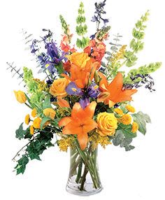 Orange and yellow mixed bouquet in a clear glass vase
