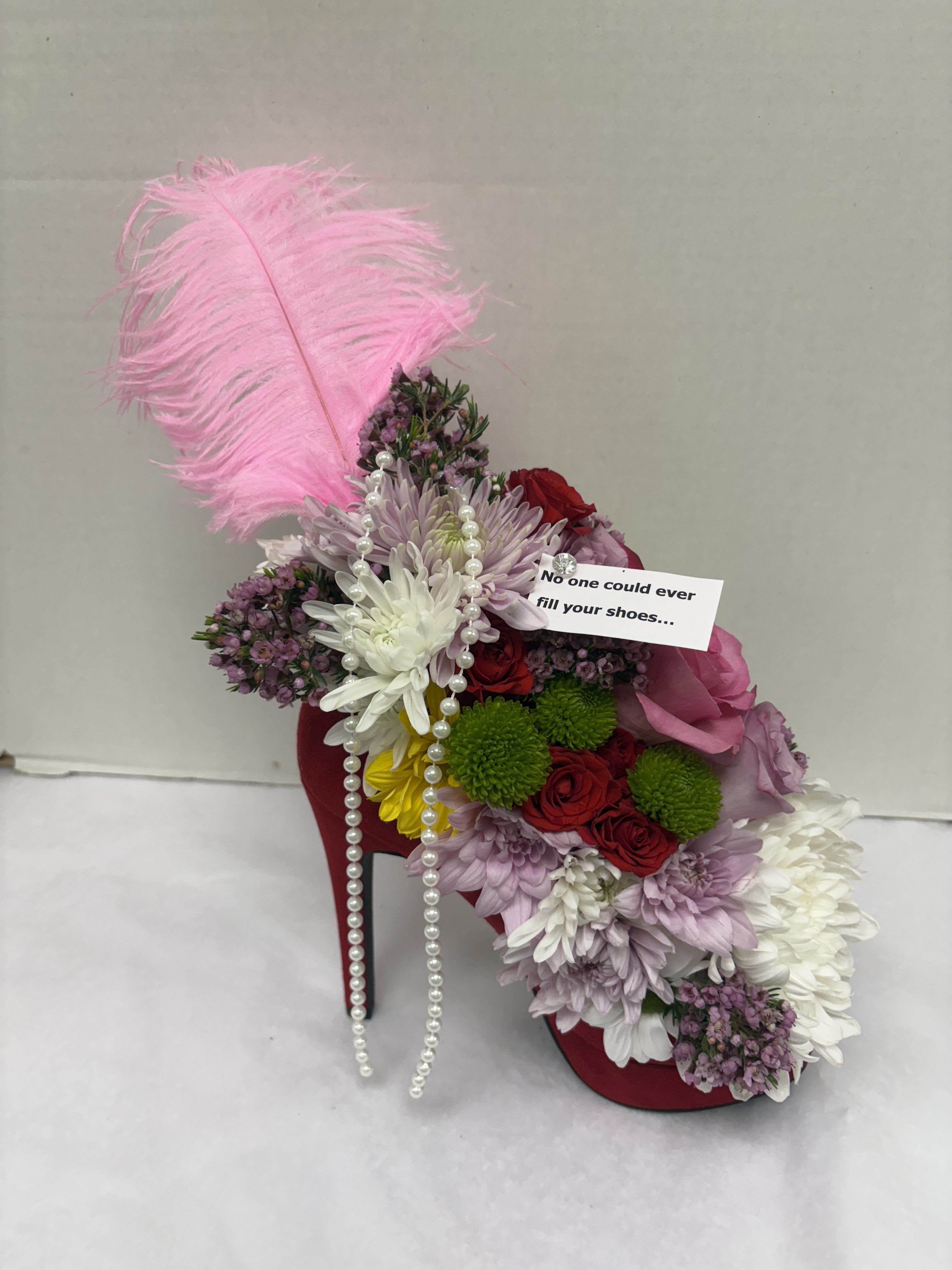 High Heel Beauty  - A unique custom flower arrangement in a real high heel shoe! No order will look the same each high heel will be a different color and flowers will be used to compliment the shoe. This is just an example of what the size of the arrangement will be and what types of flowers will be used but each design will vary in uniqueness and beauty! These are made with FRESH flowers not silk. 