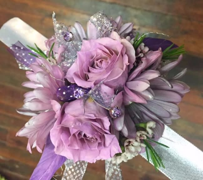 Lavender rose bouquet with purple daisies and glittery butterfly accents