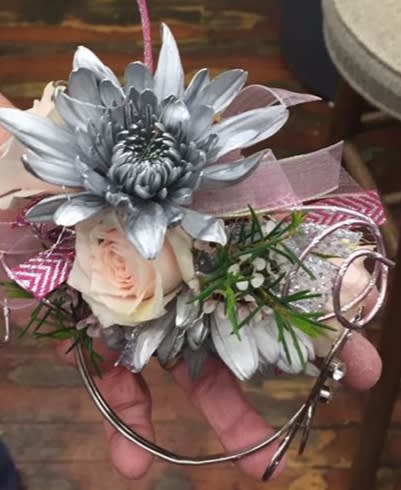 Silver flower corsage with a pale rose and pink ribbon
