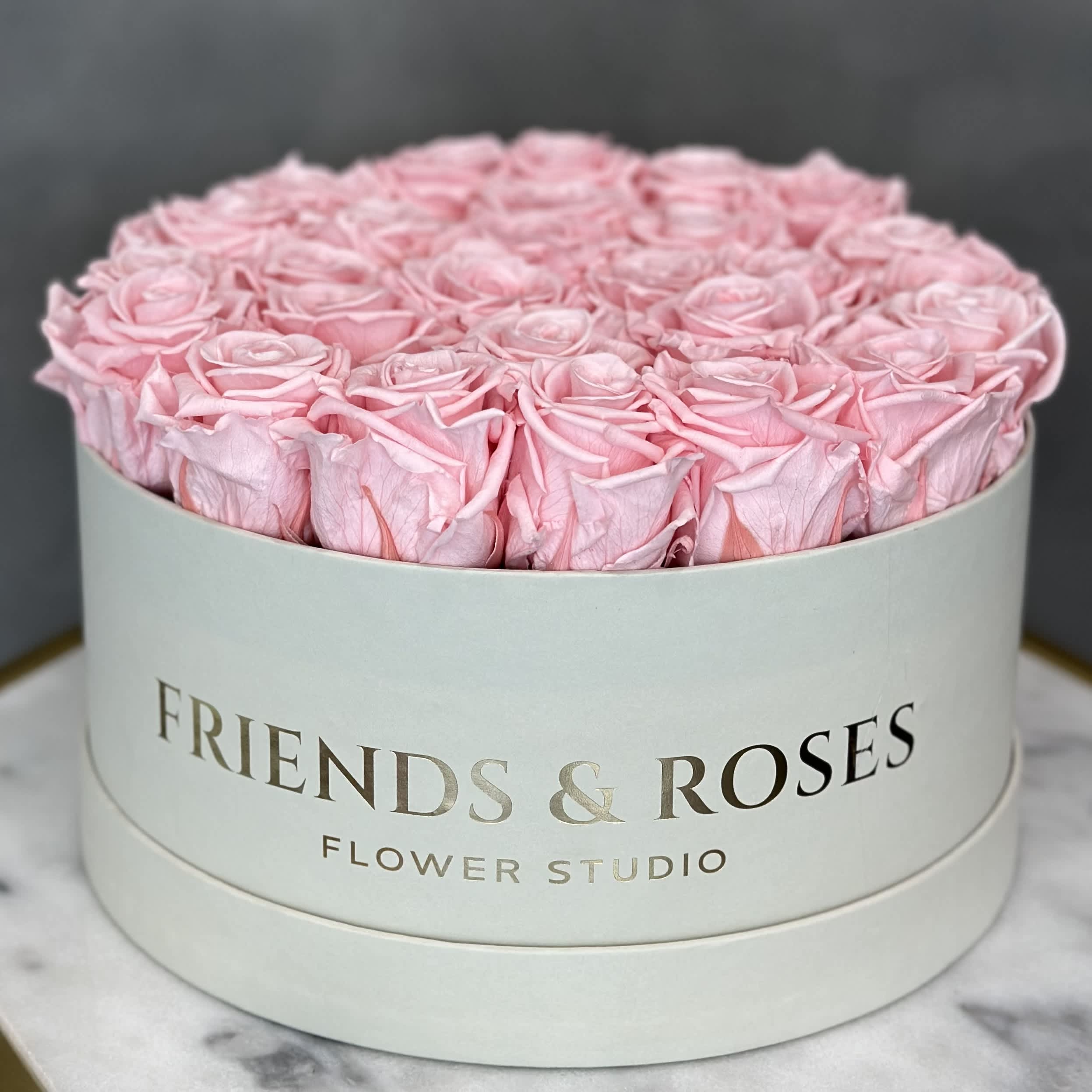 Round box of pink roses