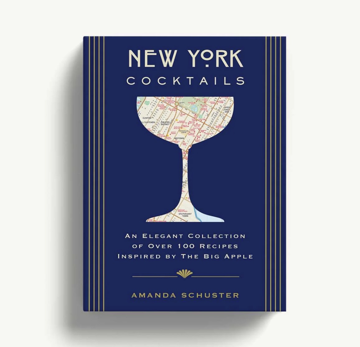 Blue cocktail recipe book with a map-filled martini glass illustration