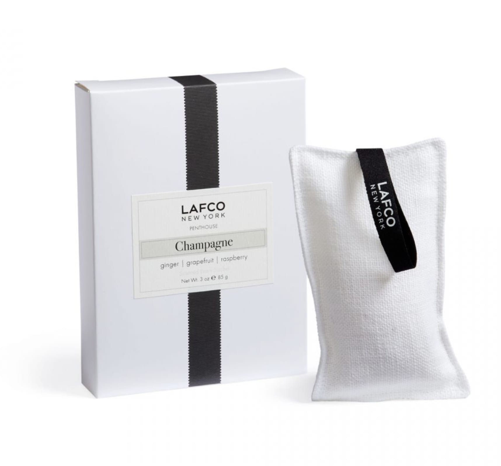 White boxed candle set with a fabric sachet labeled Lafco New York