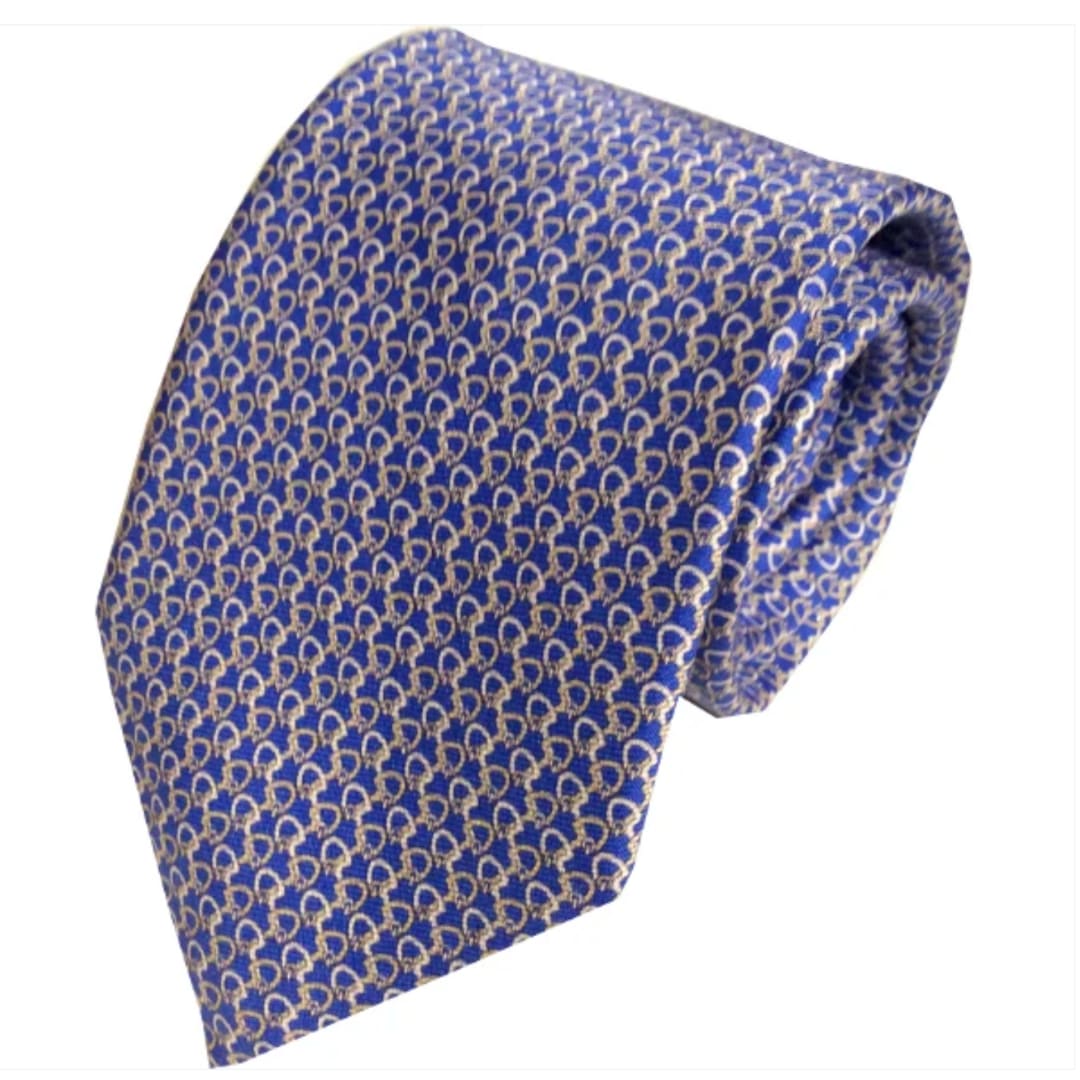 Blue patterned necktie on a white background