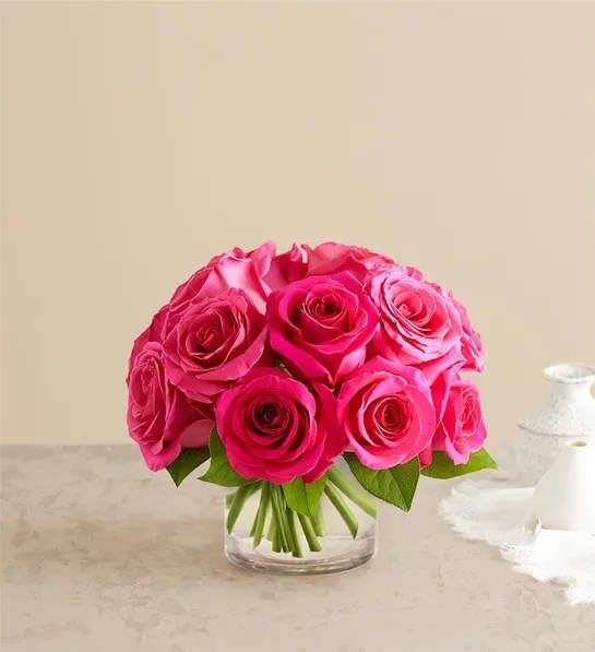 Pink rose bouquet in a clear glass vase