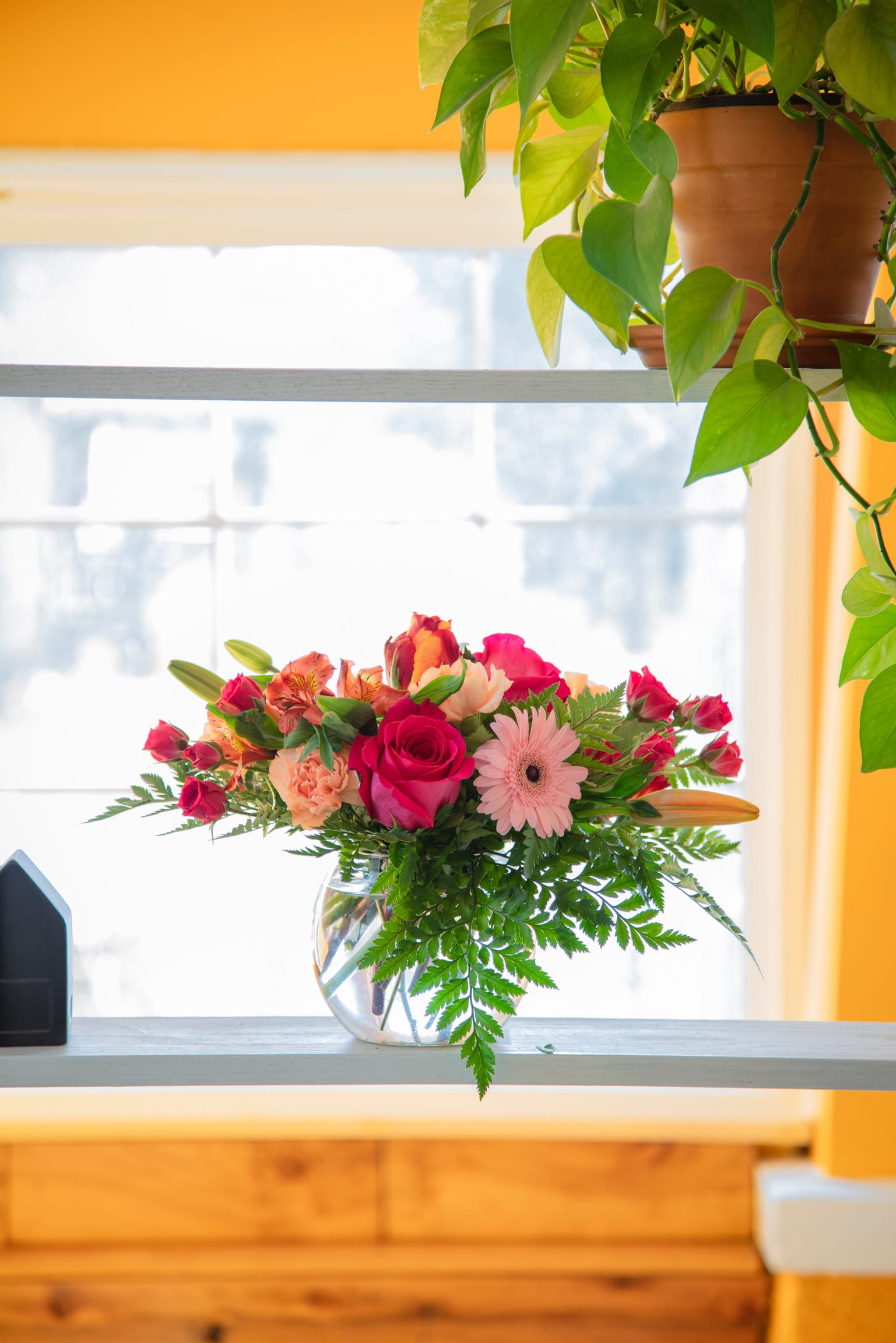 The Fishbowl of Beauty - BBC - Named for the iconic and fantastically fun "fishbowl punch", this short, low-lying design is done in a rounded bubble bowl. Bright pink and orange blooms transport you to a tropical wonderland!
