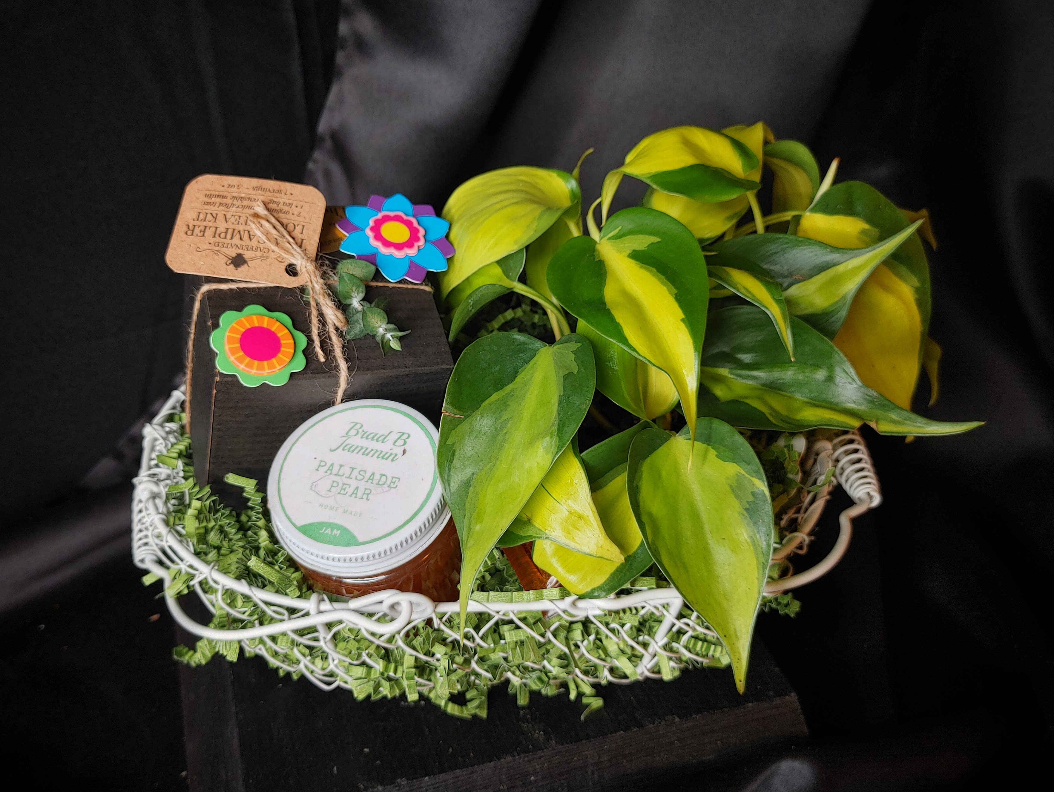Gift basket with a potted plant, jam jar, and small decorative box