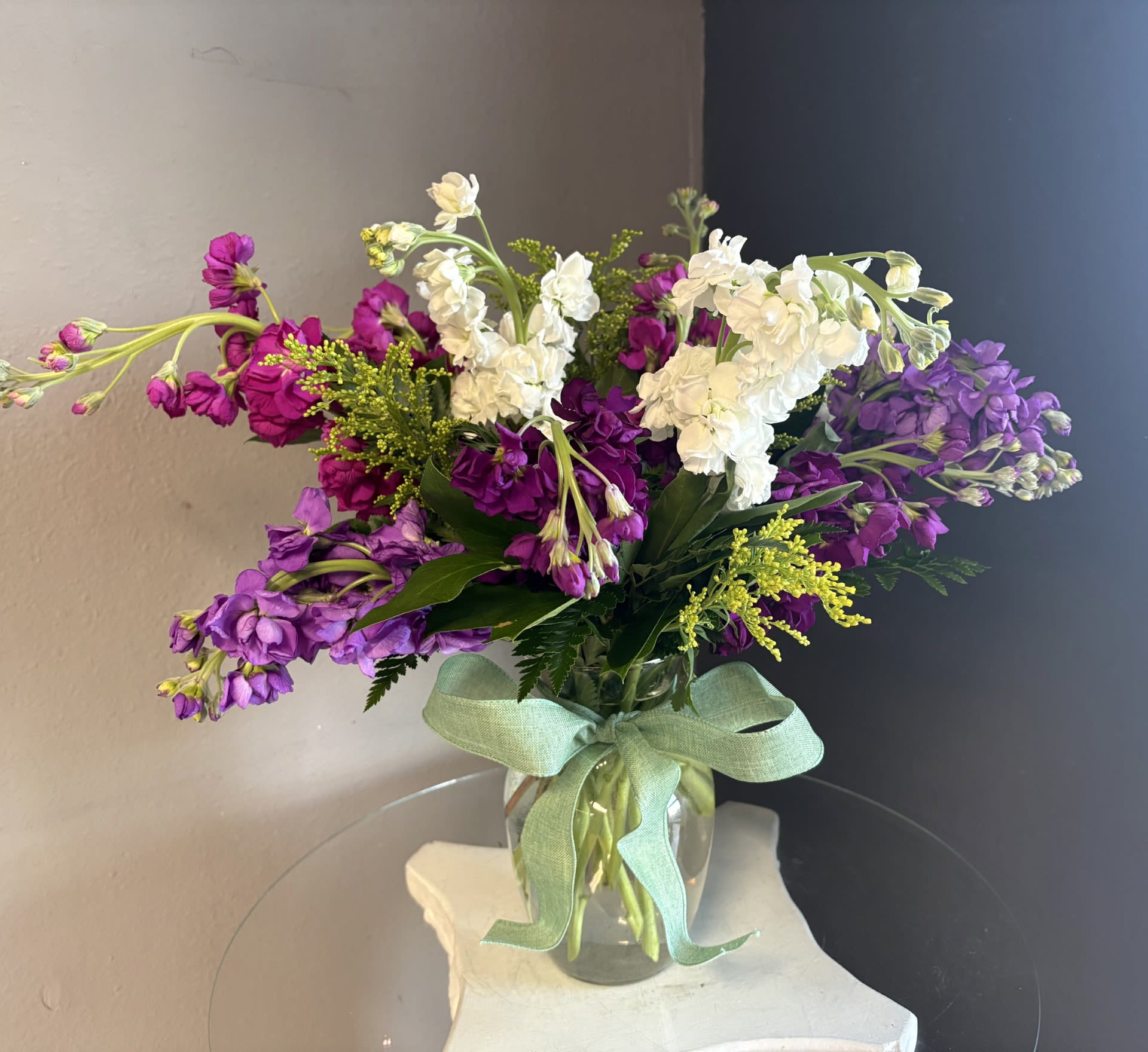 Stock - Dizzy Dozens - A beautiful arrangement of one dozen stock-- a gorgeous in color and often clove-scented flower..it is a like a fresh garden in a vase! Vase, filler and color of stock will be based on available stock.