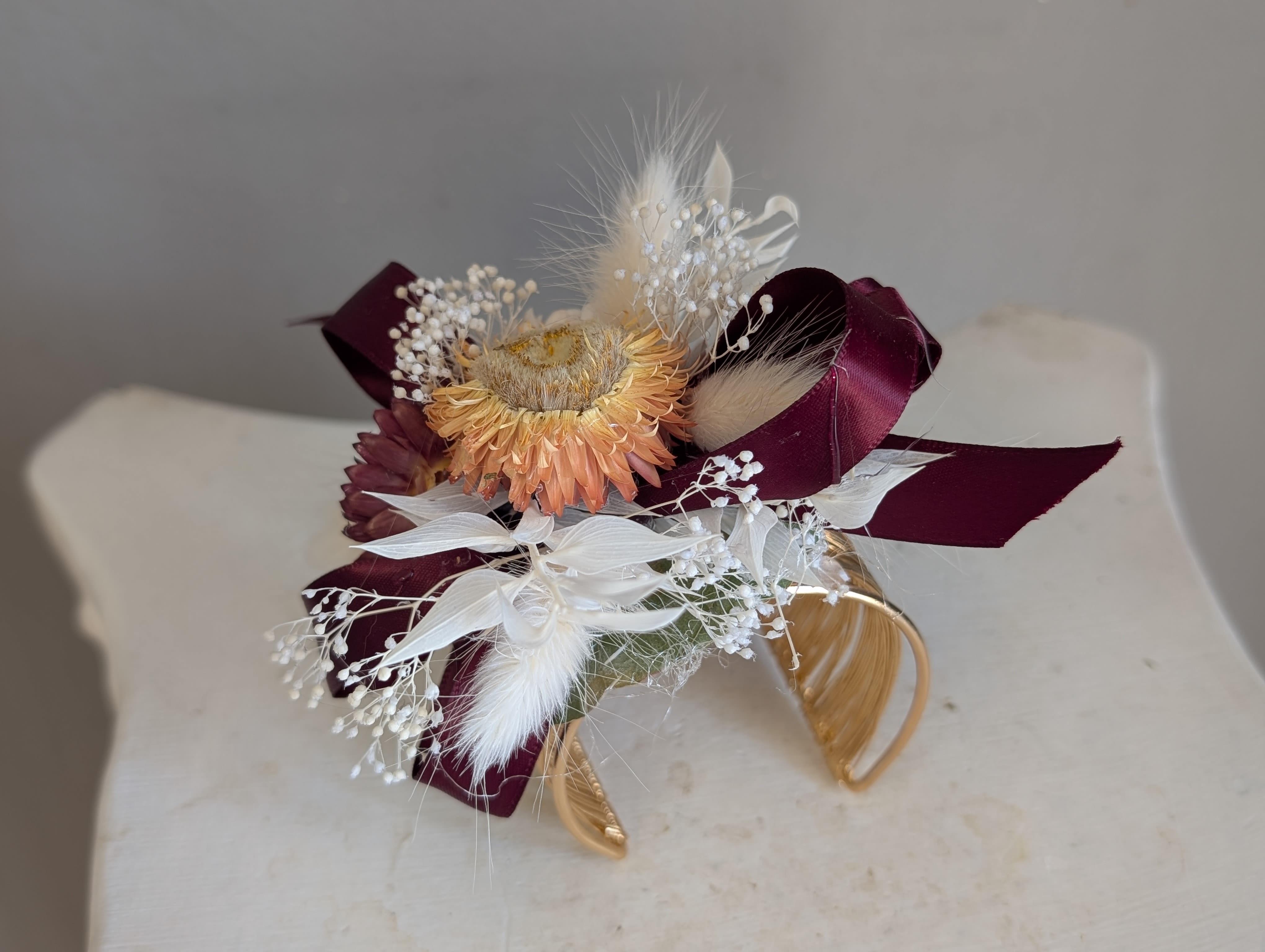 Gold band with dried corsage wt/c/burg - A compact dried corsage built to make the person you're thinking of feel cherished on a wedding day, prom night, or any formal or fun celebration. 