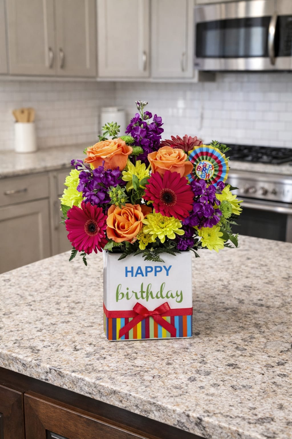 Birthday flower arrangement in a white gift box with roses and daisies