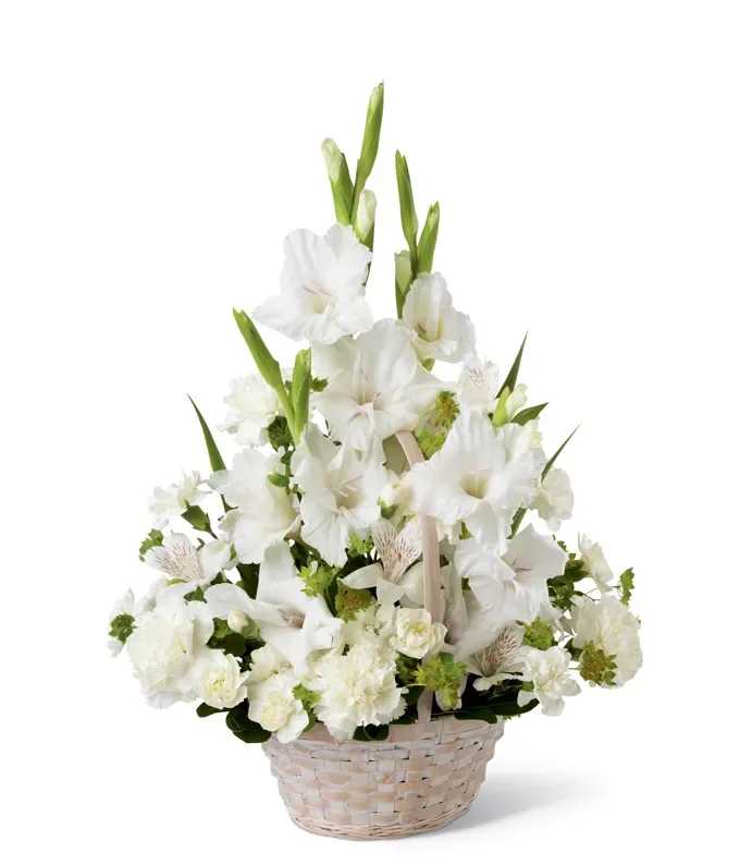 White gladiolus and carnation basket arrangement with tall spikes and round blooms