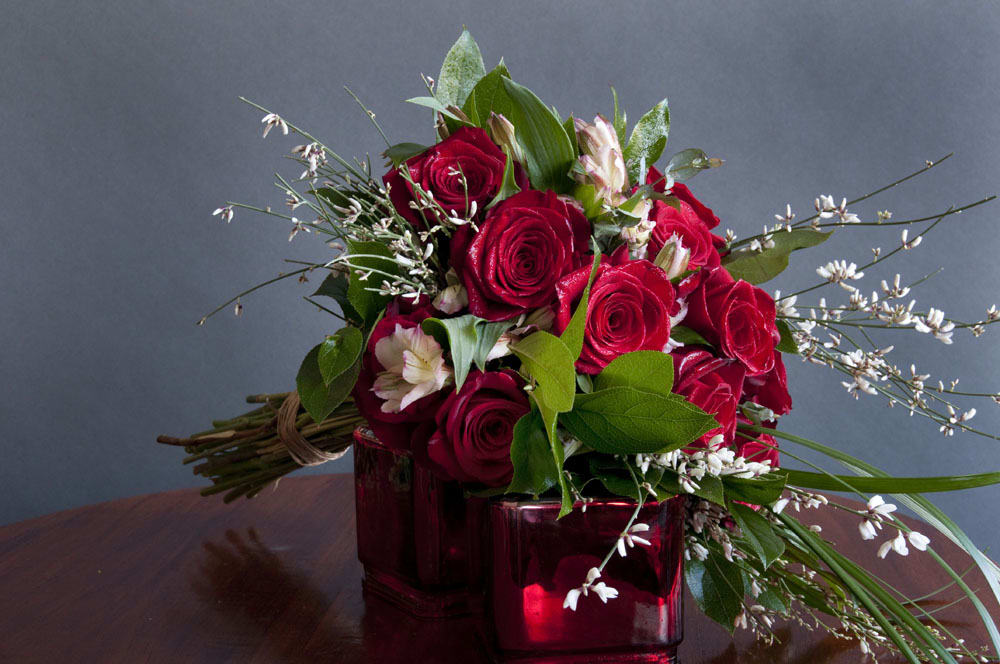 Doz Roses WRAPPED - A wonderful hand tied bouquet of roses, accent flowers and mixed green, hand tied and ready to drop into your vase!   PLEASE SELECT A FIRST AND SECOND COLOR CHOICE!