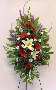 Standing floral spray with red, white, yellow, and purple flowers