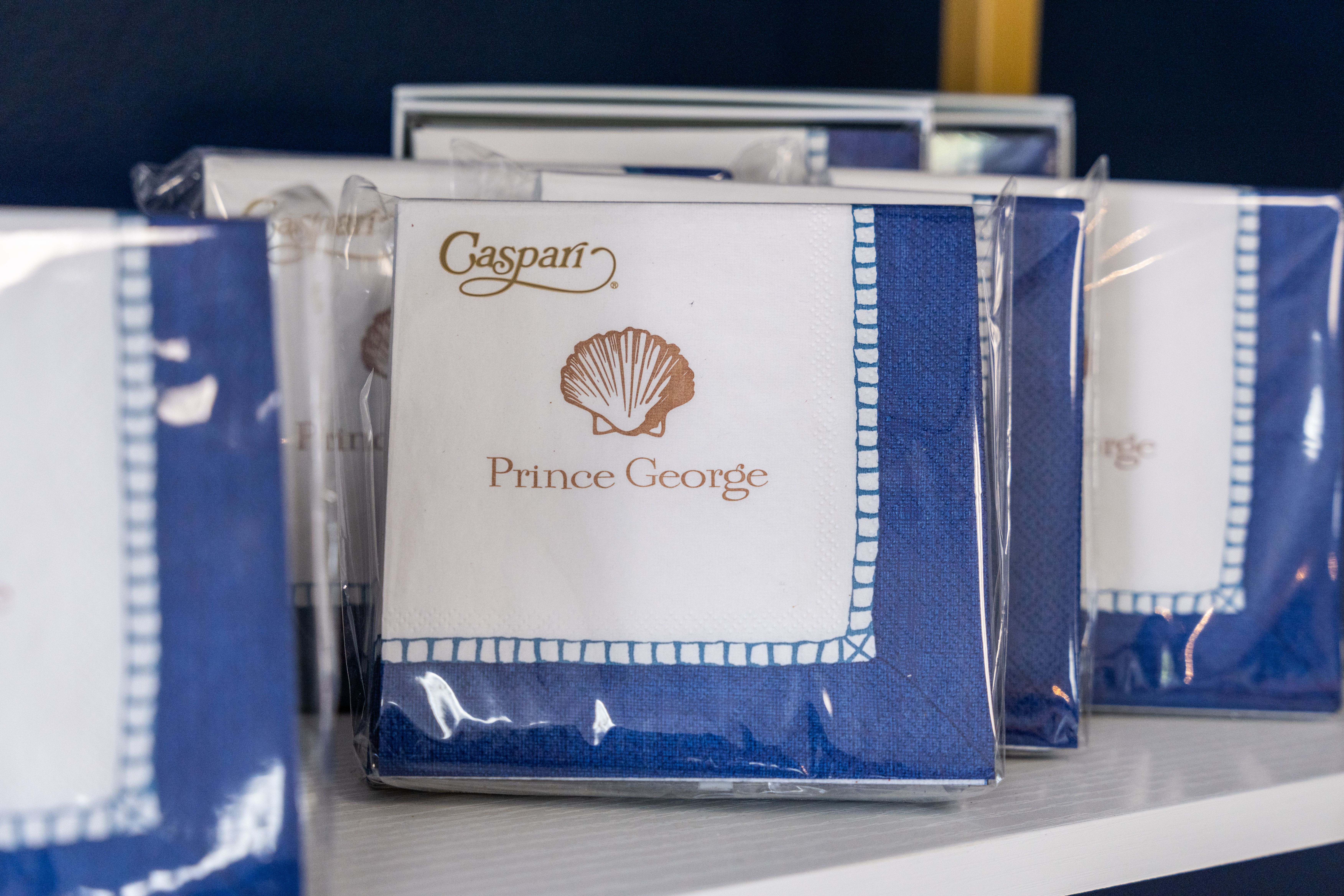 Stacked blue and white napkins in plastic packaging