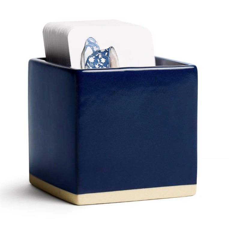 Blue ceramic container holding a stack of cards