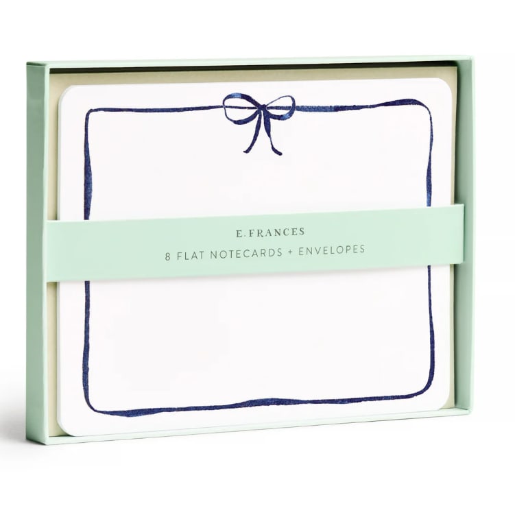Boxed set of flat notecards and envelopes with a navy bow design