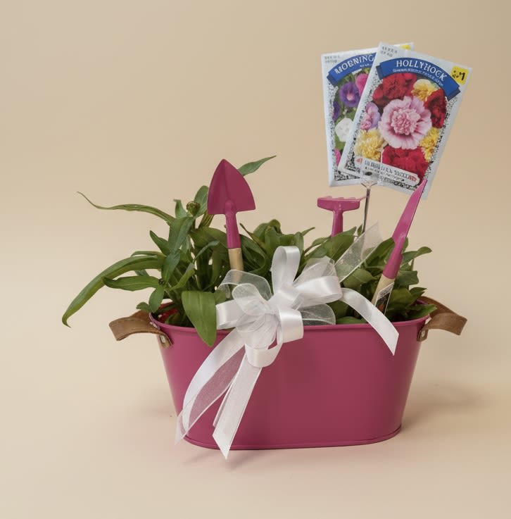 Colorful Tin Planter - Cute tin planter with mini tools attached. Currently planted with Zinnias of various colors. Great for the gardener you love and appreciate in your life. Limited Availability! Flower seed packets come with this great gift!  **Colors of planters may vary. For special requests, please call for availability**