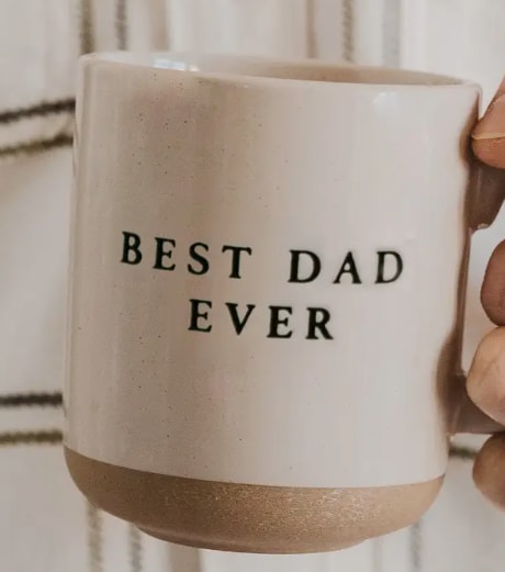 Best Dad Ever Mug - Description Tell dad he's the best with our Best Dad Ever mug. Made for his morning coffee, this stoneware mug is a best-seller for Father's Day displays and gifting.  DETAILS:  • 14oz Stoneware Style Mug • Size: 3.46 x 3.93" (5.19" w/handle) • Original Design: Best Dad Ever • Design on Both Sides of Mug • Cream With Black Lettering • Speckled Design with Natural Bottom Details • Each piece is hand-crafted, making the character of each mug perfectly unique. There may be slight variations. • Designed in the USA, Imported