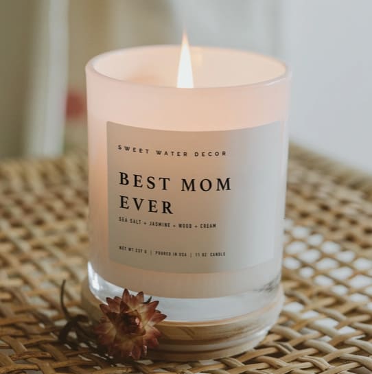 Best Mom Ever! 11 oz Soy Candle - Description Celebrate Mother's Day, Valentine's Day, and more with a gift for mom. Our relaxing Spa Day scent offers the relaxation she needs, and our white jar seamlessly goes with any space. Great for baby showers, baby announcement, and more!  SCENT NOTES: • Top: Sea Salt, Jasmine • Middle: Wood • Base: Cream  CANDLE INFO: • Size: Volume 11oz | 214g Net Weight | 3x3x3.5" • Burn Time: 50+ Hours • Wick: 100% Cotton (Lead and Zinc Free) • Wax: Proprietary Soy Based Wax Blend | Vegan, Non-GMO, Kosher Premium Fragrance Oil • Gluten Free, Phthalate Free, Non-Toxic • Made in Pittsburgh, PA