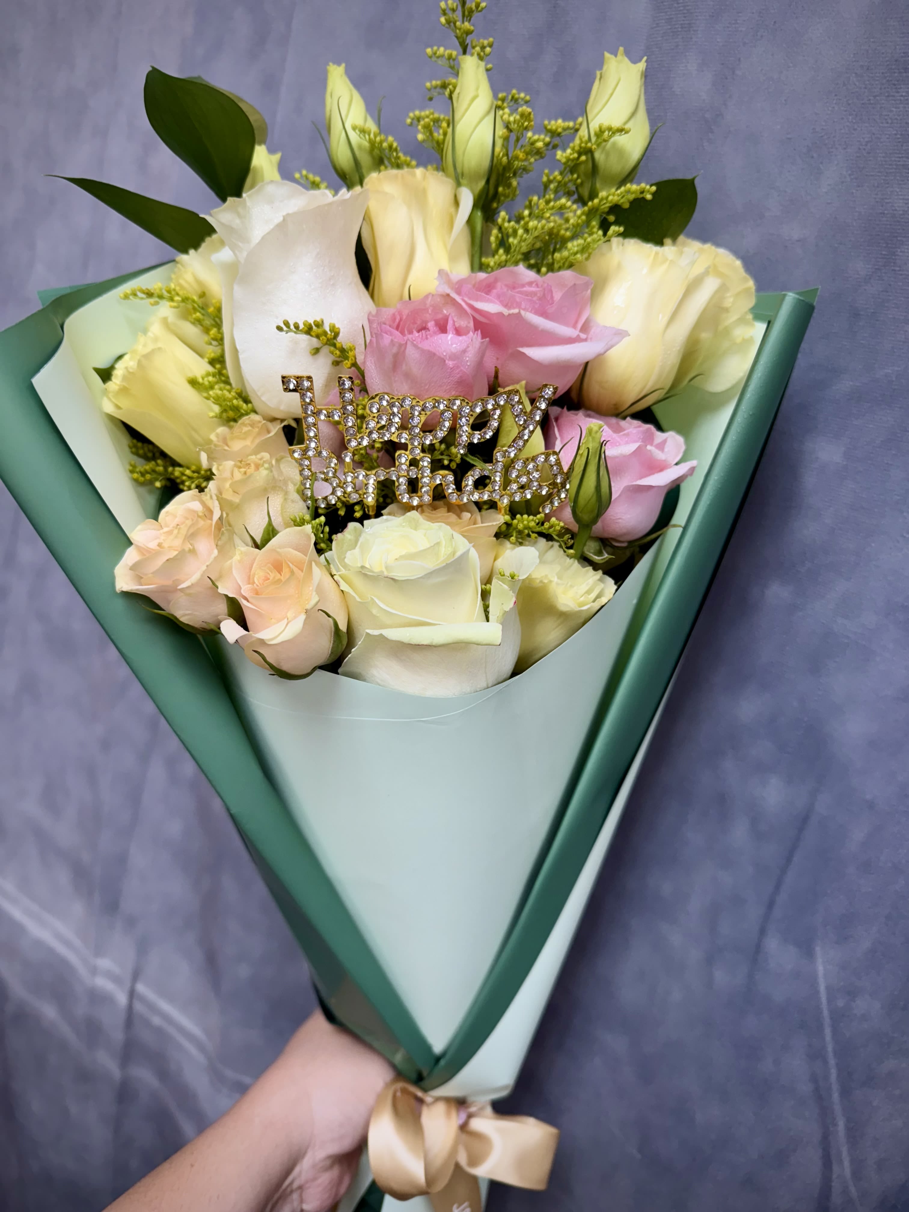 Bouquet of pink and white roses with a rhinestone "Happy Birthday" pick