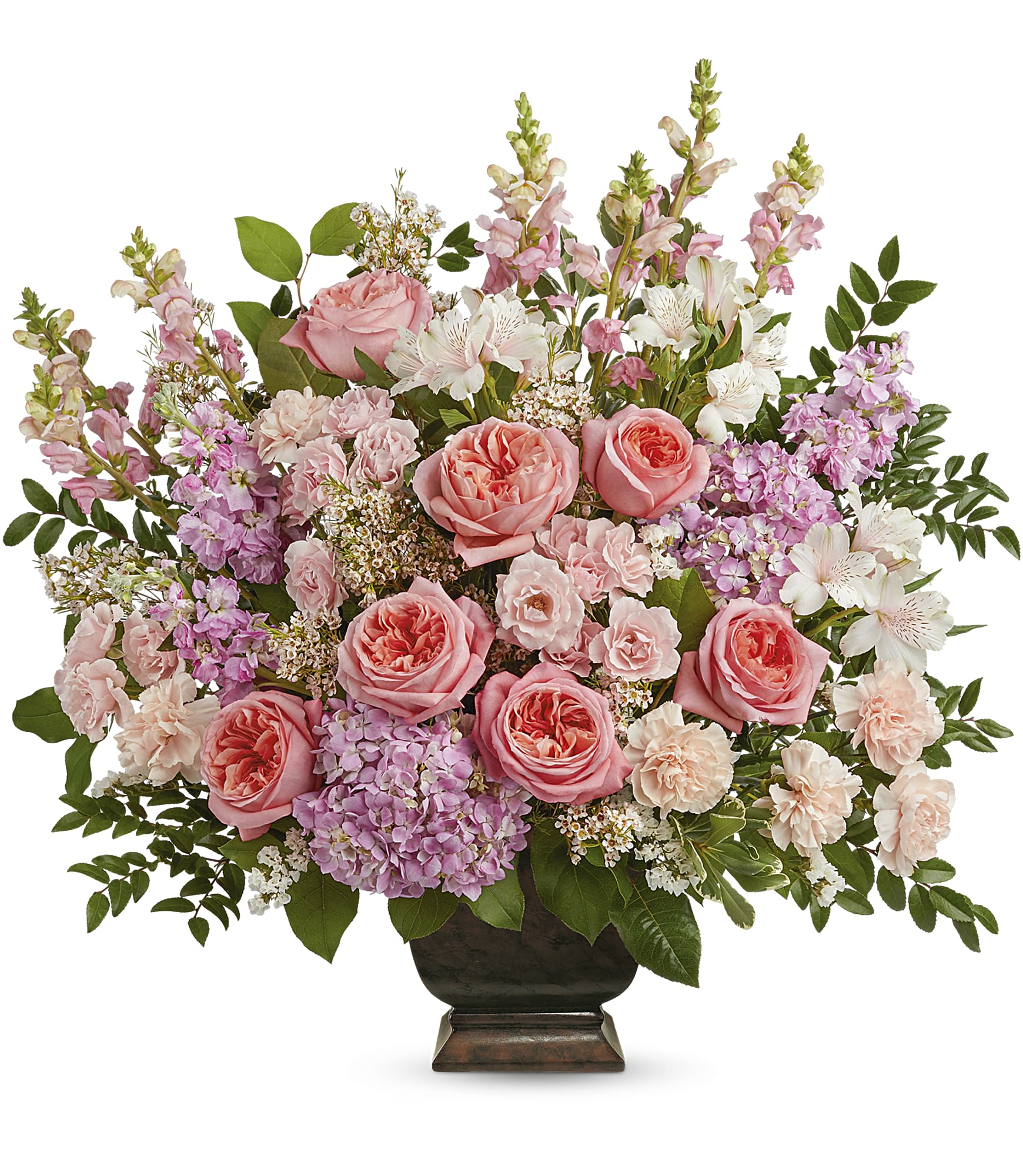 Pink roses and mixed pastel flowers arranged in a dark vase