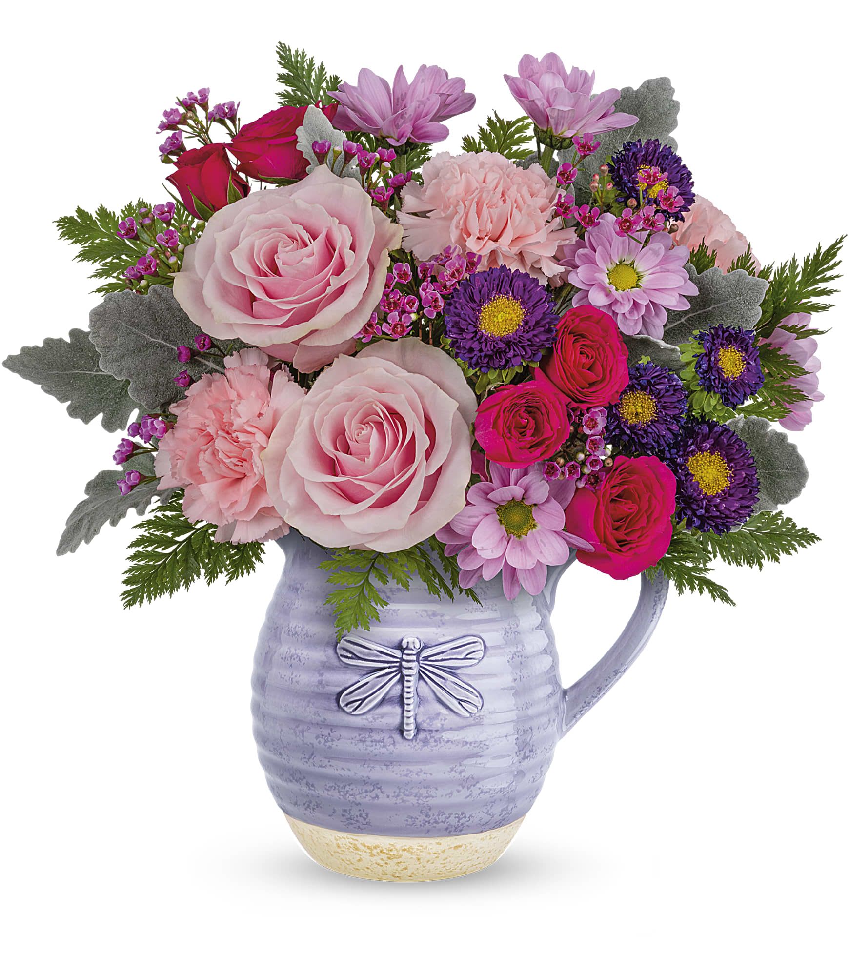 Pink and purple flower arrangement in a lavender pitcher vase