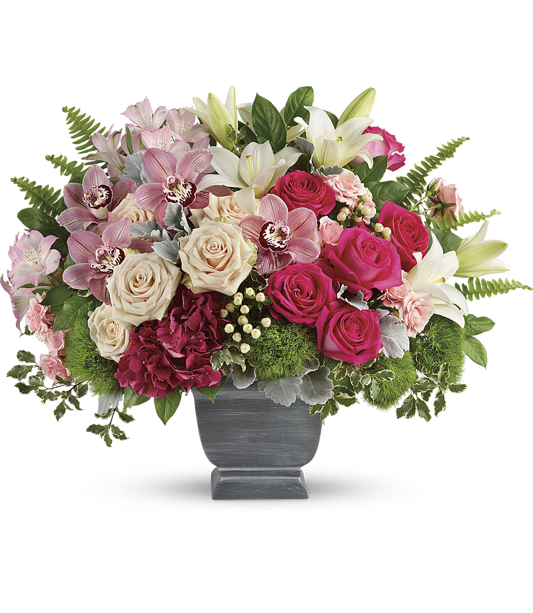 Pink and cream roses with lilies in a gray pedestal vase