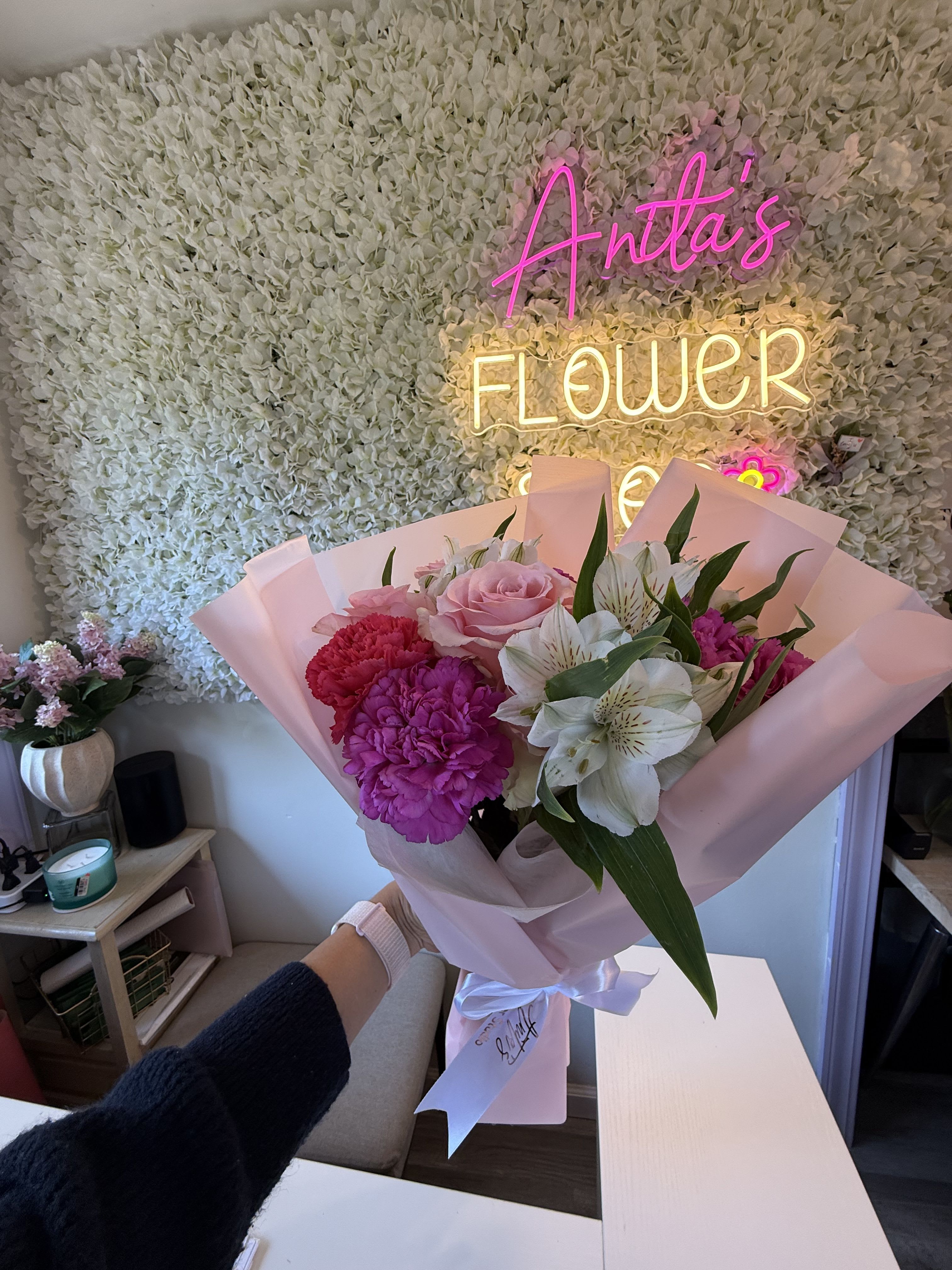 Pink and white bouquet with roses, carnations, and alstroemeria