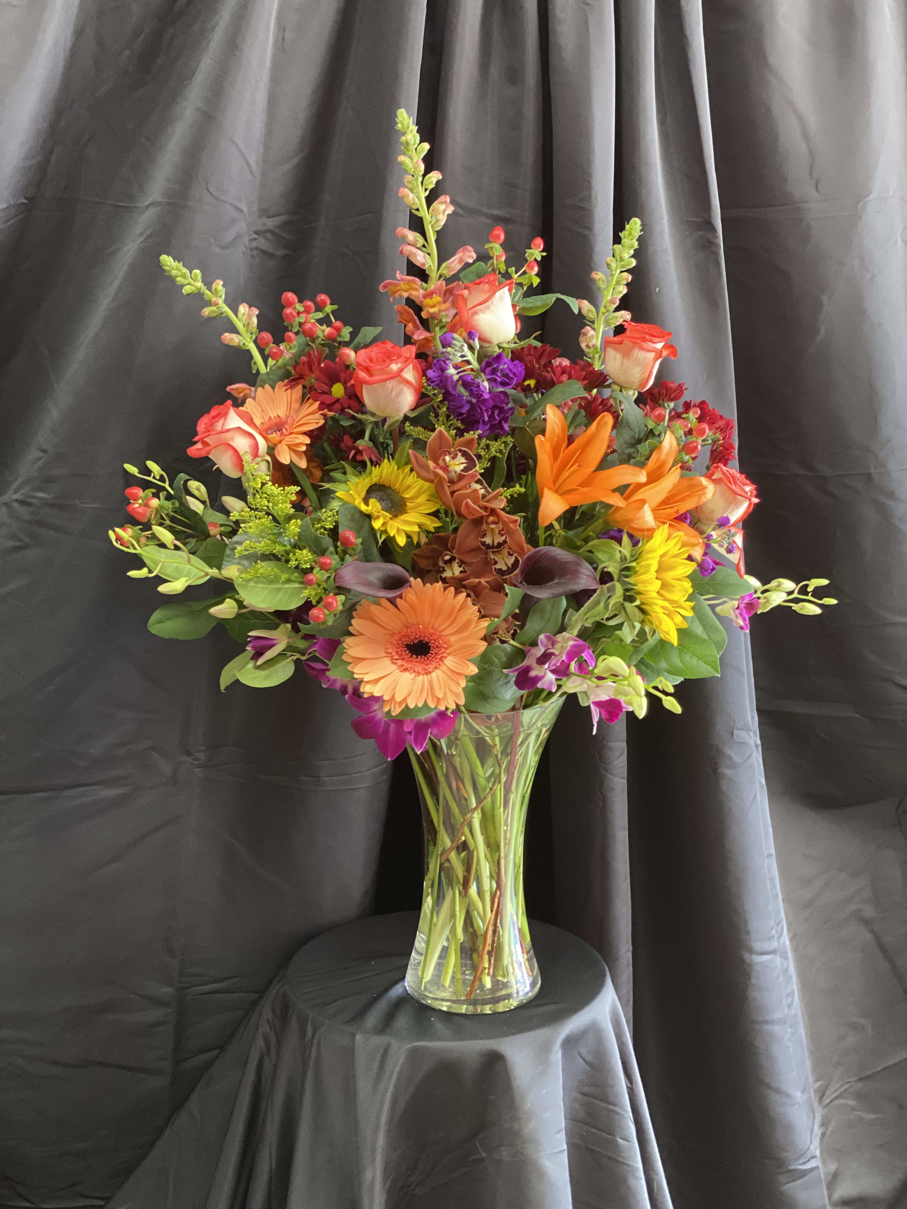Colorful mixed bouquet in a clear glass vase
