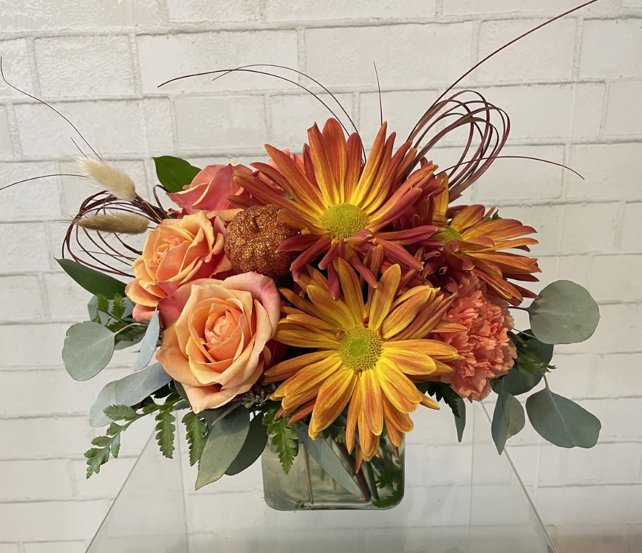 Sunrise- Sunset  - Love the colors of Fall, them this cube arragement will be perfect. The orange colors may vary in this arrangement depending on availability.  