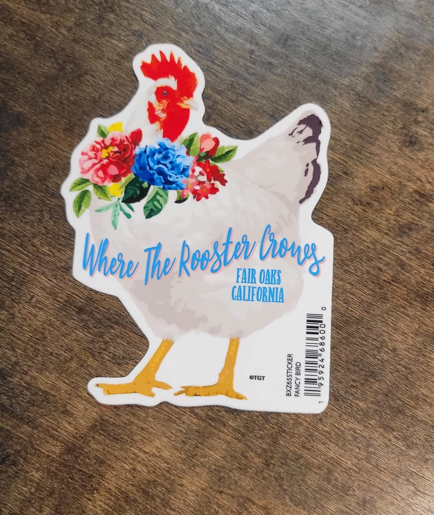 Chicken-shaped sticker with colorful flowers and text