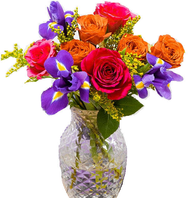 Bouquet of roses and purple irises in a cut-glass vase