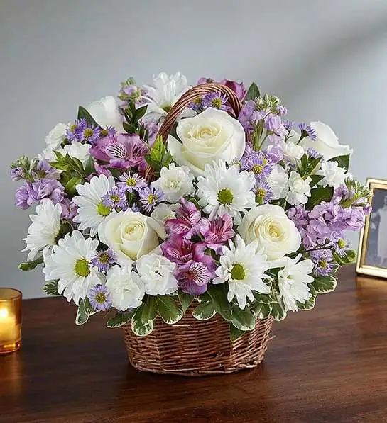 Peace, Prayers &amp; Blessings Lavender &amp; White - Just as lavender is said to hold a sacred place in nature, the departed will always hold a sacred place in your heart. Our lavender and white arrangement, artistically designed inside a keepsake willow basket, is a touching way to convey your love and sincerest blessings.