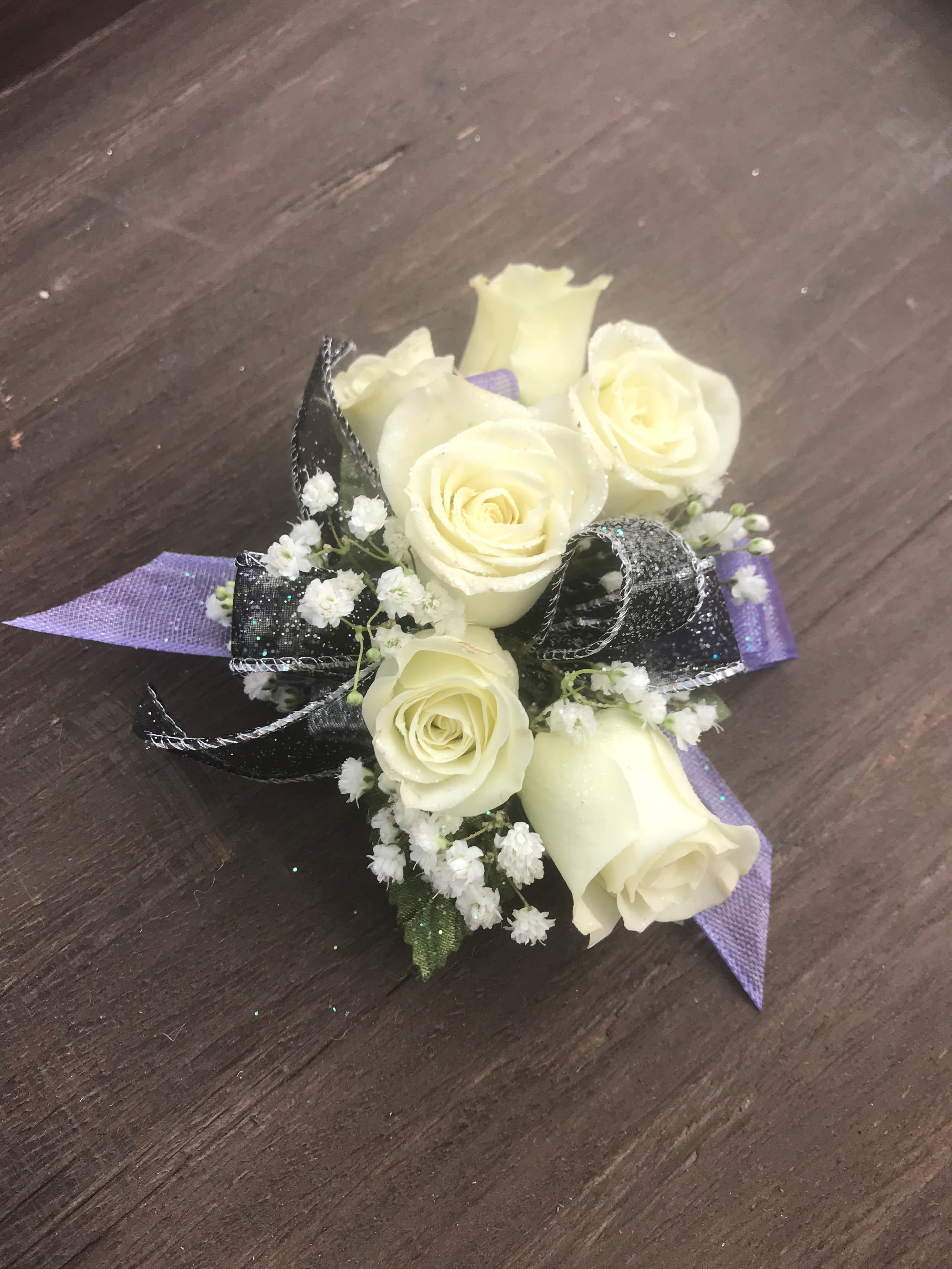 Multi Ribbon Spray Rose Corsage - Spray Roses of your color choice with two ribbon accents of your choice designed on an elastic wrist band and finished off with babies breath.