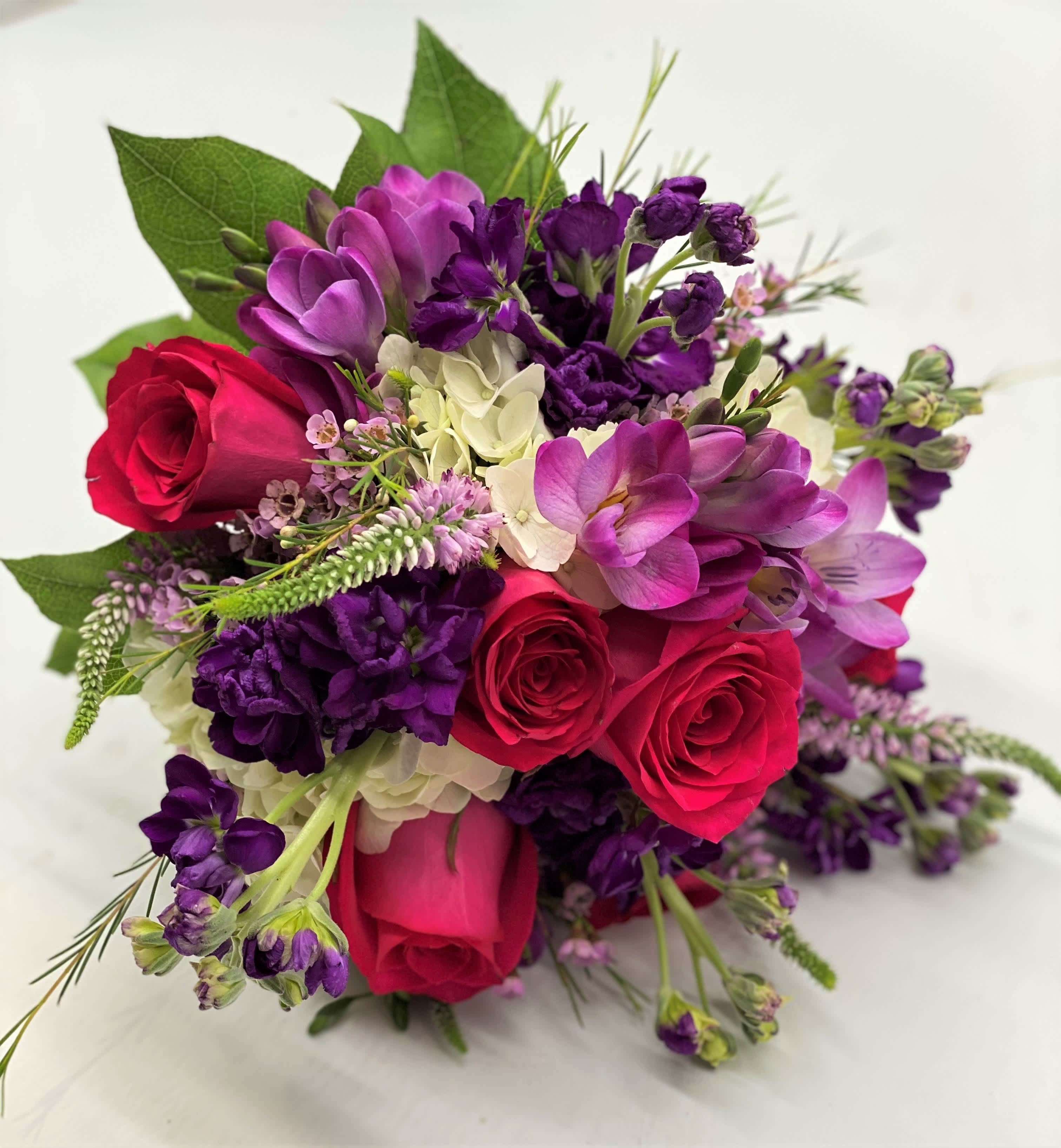 The Purple Passion Clutch Bouquet - The lush mix of hot pinks and purples with touches of white.