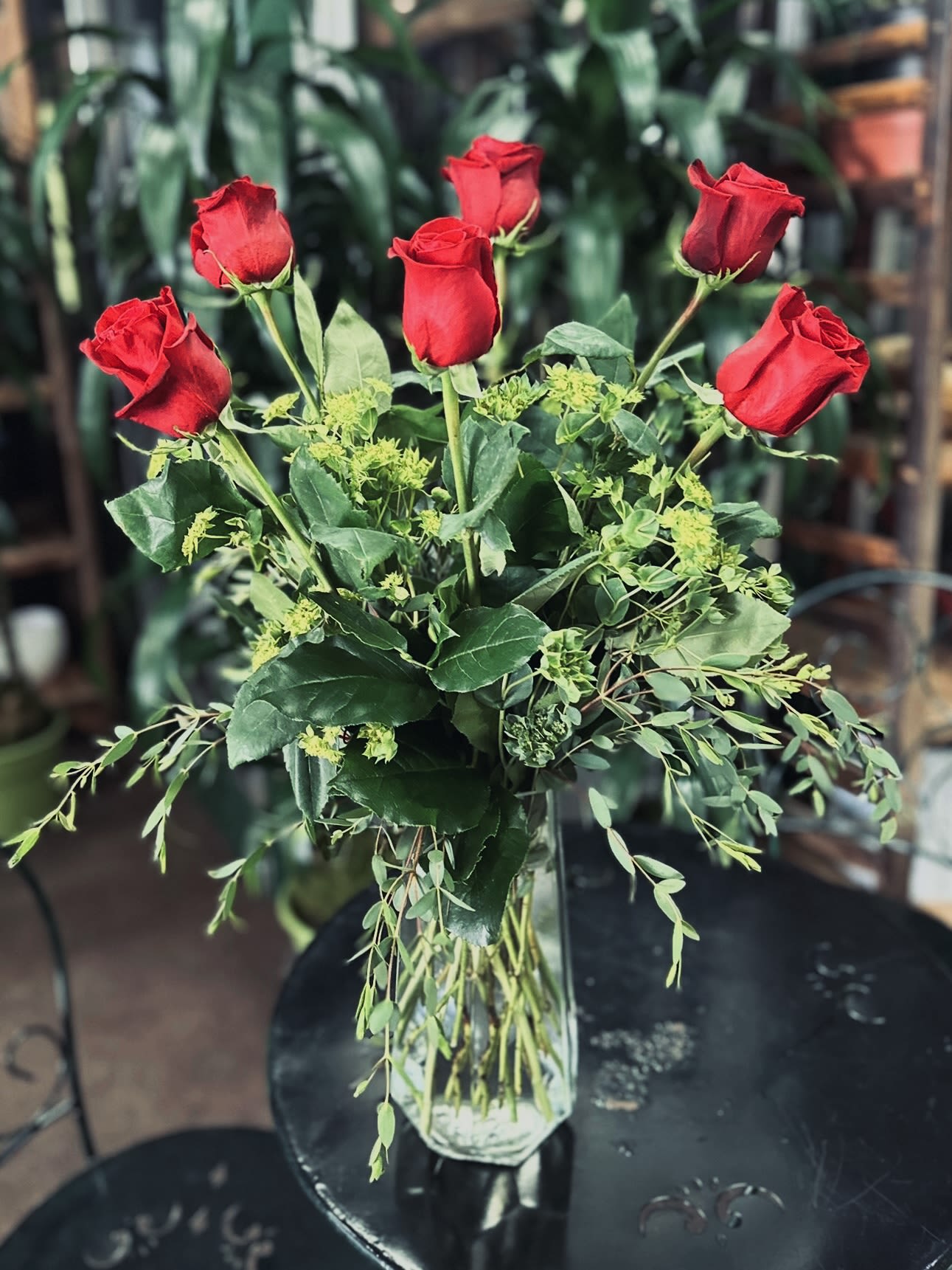 Bouquet of red roses in a clear glass vase
