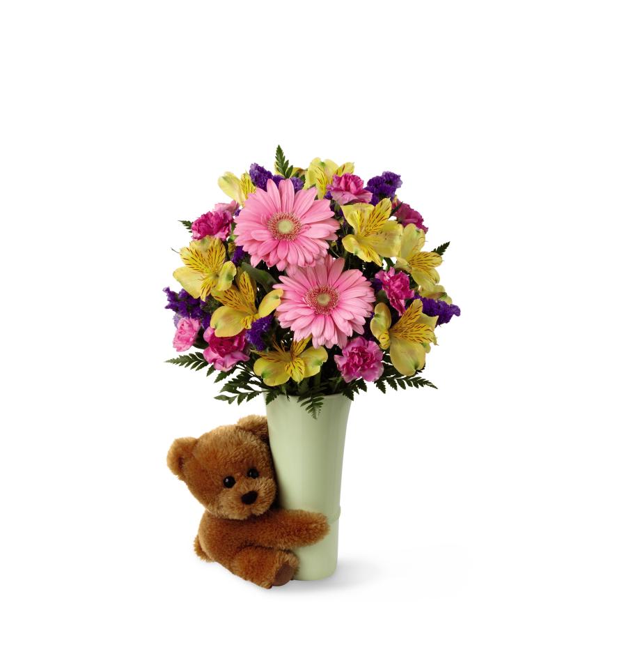 FTD Festive Big Hug Bouquet - The FTD Festive Big Hug Bouquet is a bright and beautiful way to send   your warmest wishes and sweet affection. Pink gerbera daisies are   surrounded by yellow Peruvian lilies, fuchsia mini carnations, purple   statice and lush greens perfectly presented in a ceramic light green   vase hugged by a darling brown plush bear to create an incredible gift   for any occasion. GOOD bouquet includes 9 stems. Approx. 14H x 10W.   BETTER bouquet includes 13 stems. Approx. 15H x 11W. BEST bouquet   includes 18 stems. Approx. 16H x 12W.   