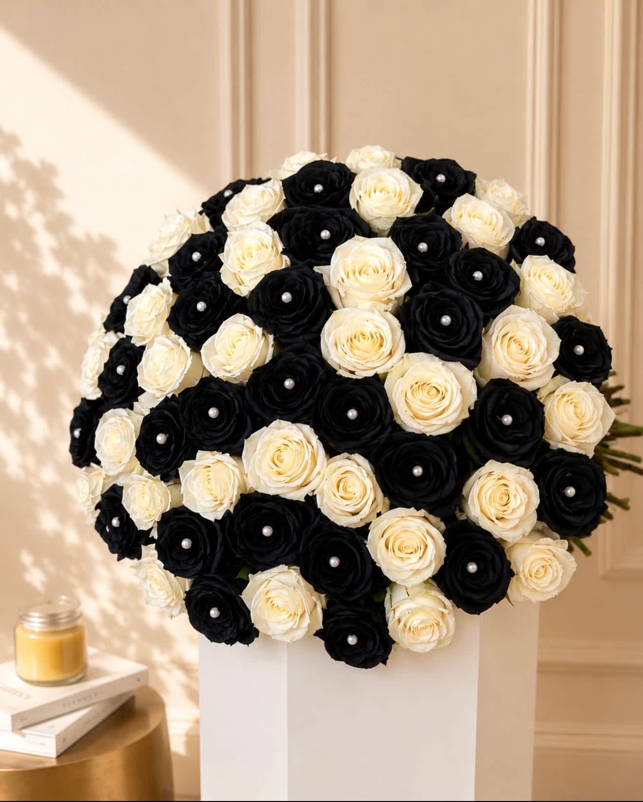 Black and white rose bouquet with pearl accents in a white box