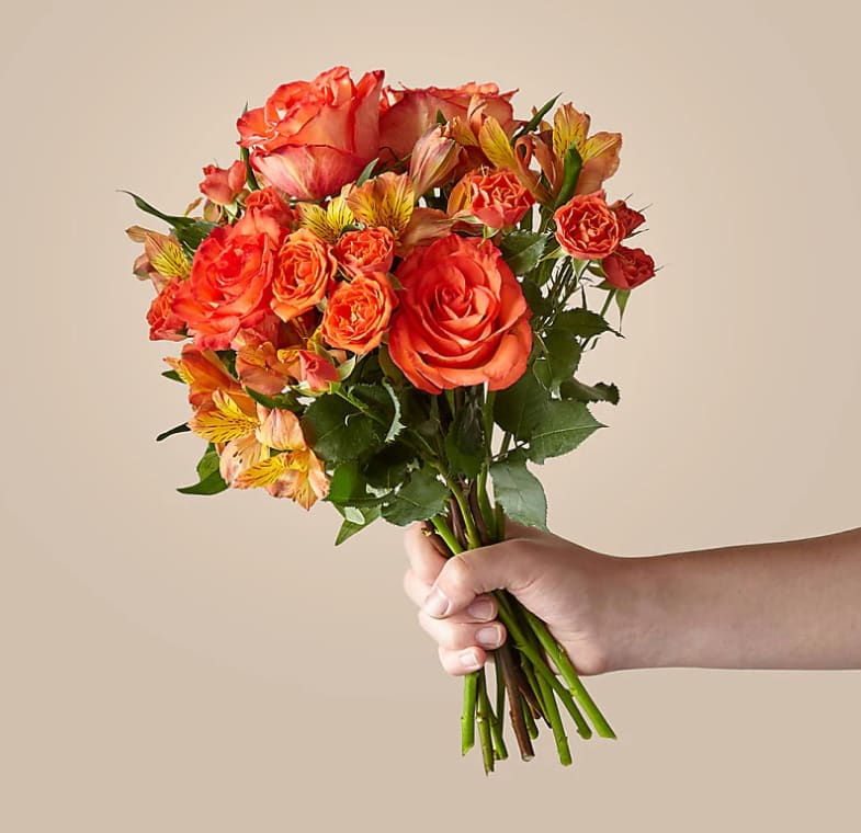Fresh Squeezed Bouquet - Is there anything better than waking up to a pop of freshness in your home? Our Fresh Squeezed bouquet brightens up any space with a juicy mix of vibrant roses, spray roses and alstroemeria.  The Original Bouquet is approximately 16"H by 14"W.