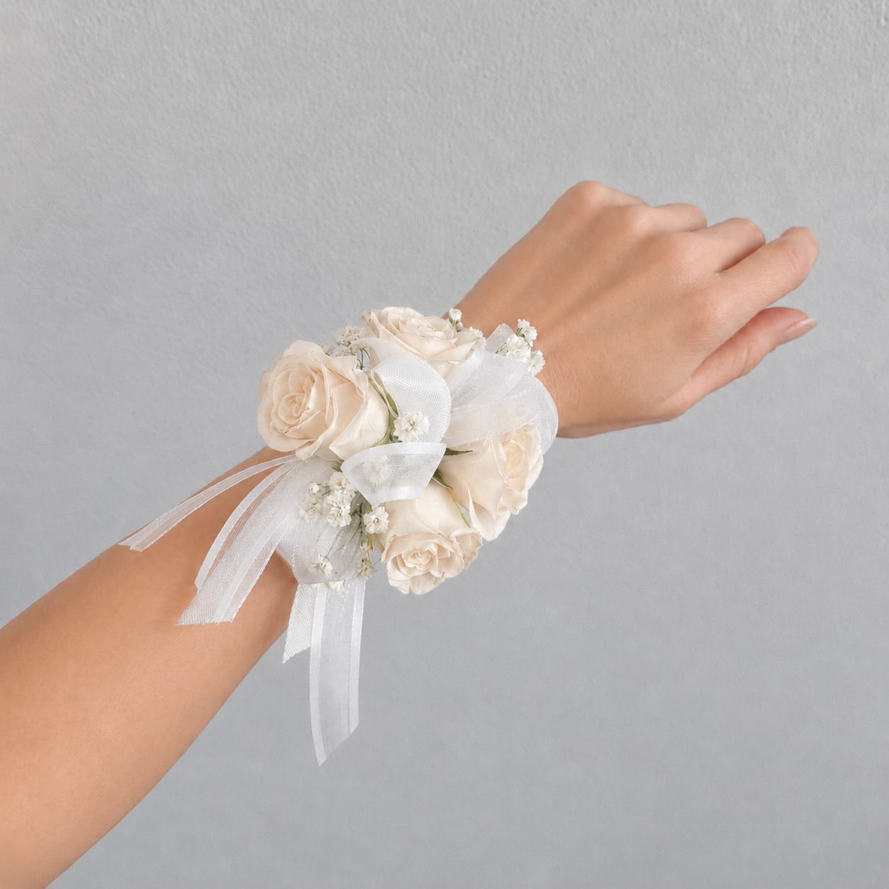 White rose wrist corsage with ribbon ties