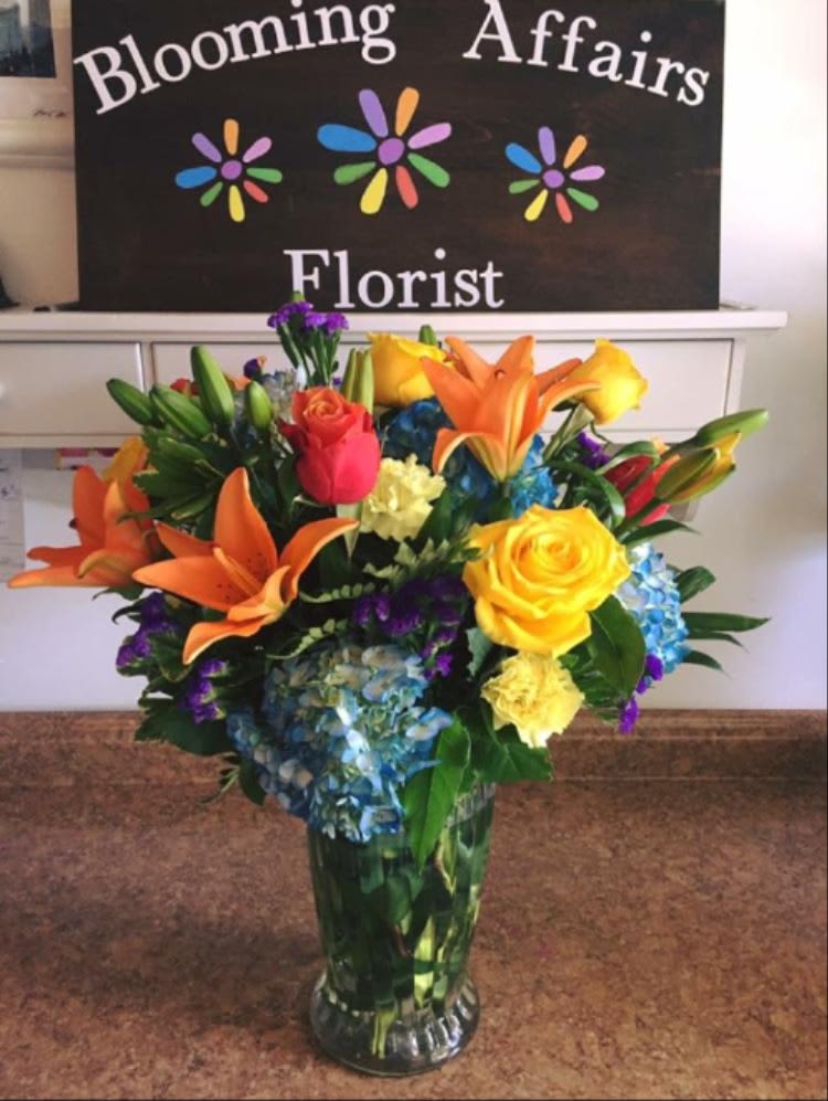 Colorful mixed bouquet in a clear glass vase