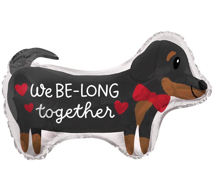 Dachshund-shaped balloon with "We BE-LONG together" text and red hearts
