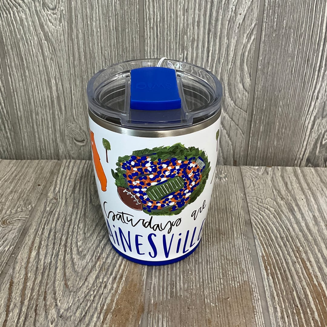 Insulated tumbler with a football-themed design and blue lid