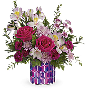 Pink roses and white alstroemeria in a patterned vase